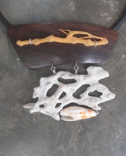 A one of a kind pendant with beautiful corals and shell on 21" leather cord.